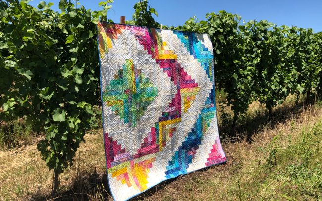 Quilt hanging from the vines